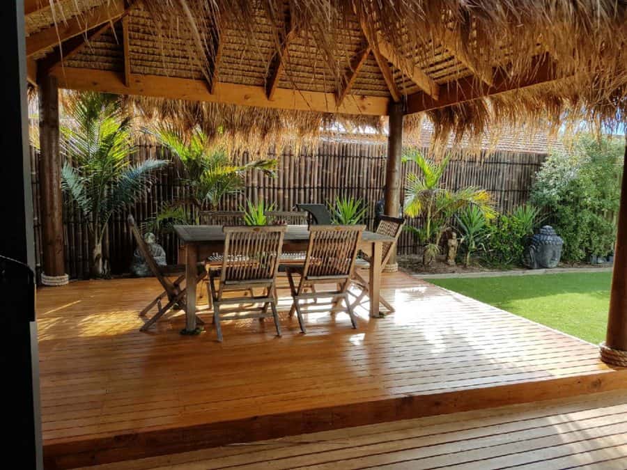 Bali Hut with deck table and chairs and bamboo in yard