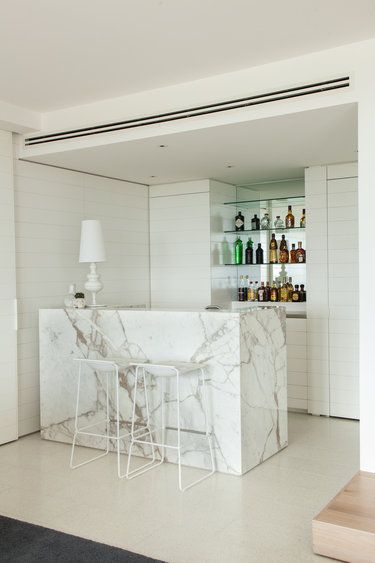 Gallery | Australian Interior Design Awards. Marble cocktail bar. White timber panelling.
